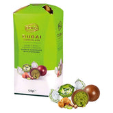 The Bolci Dubai Chocolate Truffle Gift Box (120g) features milk chocolates filled with pistachio kadayif, with some unwrapped to show the creamy green filling and crunchy nuts against the elegant packaging.